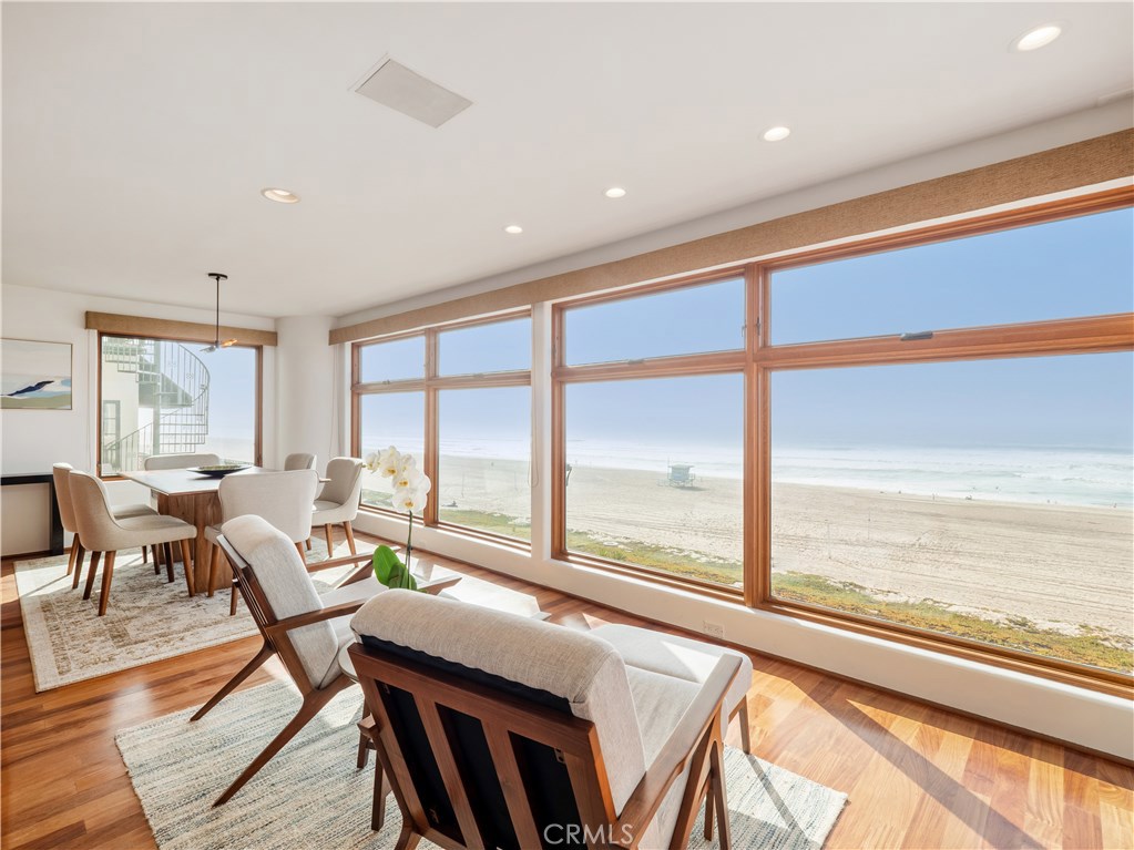 Experience oceanfront living with breathtaking views of the Pacific spanning from Catalina Island and Palos Verdes Peninsula to the majestic Malibu coastline. This North Manhattan Beach Strand home provides the opportunity to entertain in luxury as well as relax while listening to the waves break on the vast sandy beach of the South Bay. From the spacious decks, you’ll enjoy BBQs and beach activities by day and stunning sunsets that will provide endless photo opportunities. The entrance to this beachfront home provides a peaceful atrium with a custom built in spa before entering into the open floor plan featuring a chef's kitchen with stainless steel Viking and Subzero appliances and granite countertops as well as the family room, oceanfront dining area, and sitting area allowing for panoramic ocean views from every location. The downstairs bonus room boasts a beautiful bar and entertainment area that opens to a deck with a built-in BBQ and plenty of room for dining al fresco. Upstairs you will find a luxurious master suite with peaceful breathtaking views of the ocean and a grand deck where you can relax well above the beach activities of The Strand. In addition to the main house, there is a guest house or income apartment above the garage with an open floor plan and vaulted ceilings, two bedrooms, and one bath. It is the perfect time to experience the lifestyle that Manhattan Beach and everything oceanfront living has to offer!