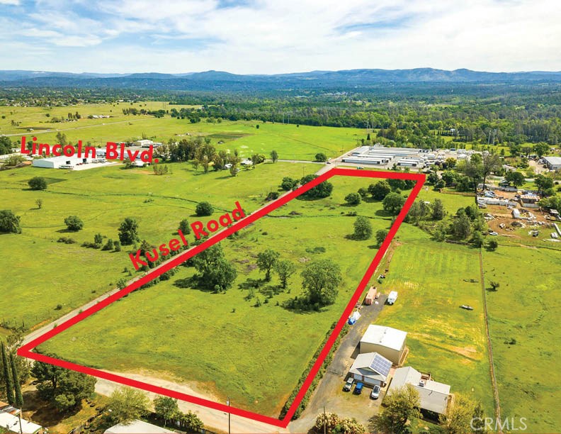 The parcel is roughly rectangular in shape and is sloped slightly toward the middle at each end. It is bounded by Kusel Road to the north, Lincoln Boulevard to the east, Custer Lane to the west and it shares a property boundary with the property to the south. It is approximately 1264 feet by 330 feet. This nearly 10 acre property is located in south Oroville in the path of development. With a General Industrial zoning under the current General Plan, there is a lot of flexibility for this site. It’s also part of the area designated as the “South Ophir Specific Plan” which indicates that it is intended to e a focus area for future development. The area is within the South Feather Water and Power Agency. The site does appear to have power but buyers will have to determine the adequacy and location of the service line. There is no building on-site, the 900sf entry is required by MLS.