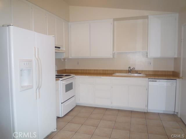 HUGE PRICE REDUCTION HURRY GREAT OPPORTUNITY FOR FIRST TIME HOME BUYER WHY RENTING!! !This 2 bedroom, 1 bathroom Serrano Creek Condo is located at very desirable community . The Unit features 2 bedroom,1 bath , has newer fresh paint and newer carpet & inside laundry room. It is ready to move in . There are washer and dryer hookups inside of home , the washer & dryer are included with price along with the refrigerator. The community has ample green space and a community pool. There is plenty of guest parking. Association fees included gas, water & trash. It is perfect place to begin homeownership or to add to start an investment portfolio .HURRY WILL NOT LAST