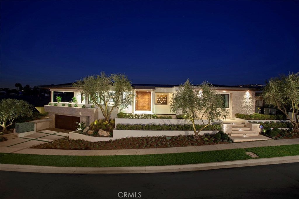Welcome to Cameo Shores, one of California’s most sought-after coastal communities. This soft contemporary, Mid-century stunner was built new in 2015 and has been thoughtfully designed with an open concept providing the ultimate indoor-outdoor lifestyle. Enjoy ocean views from this nearly 7,000 sq ft oasis with private resort-style backyard including a saltwater pool & spa. The brilliant floor plan boasts 4 oversized bedrooms all on the same level (option for 5) + 7 bathrooms. The enormous master suite hosts a separate office behind double doors, large walk in closet with custom built-ins, large steam shower and 2-person soaking tub. The gourmet kitchen showcases a cascading Calcutta island, high-end appliances incl Wolf, Sub-Zero and Bosch. The chef’s prep kitchen is outfitted with its own Wolf range and is wide open to the backyard via sliding pocket doors. The lower level consists of a media room w/ wet bar, temp-controlled wine cellar, full bath, 4-car garage, elevator, & home automation. Enjoy private beach access or relax on the rooftop deck while you take in the 360 degree views of Catalina and the hills of Newport Coast. View sunsets over the Pacific from the heated front terrace or backyard fire pit. This one-of-a-kind home is not to be missed.