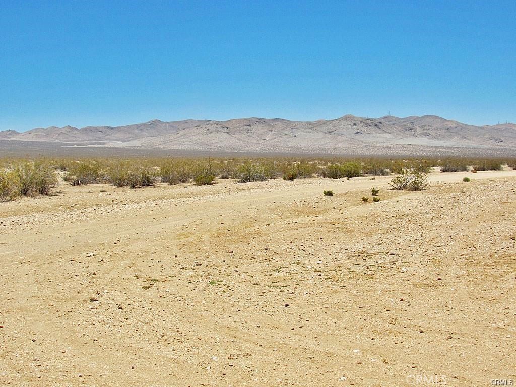 There is not an address associated with this parcel. What is reflected is the Parcel#277-063-03-00-6 which is +/-18.37 AC. Zoning is O/RA. Located in California City. Access via dirt N. Columbia Rd.