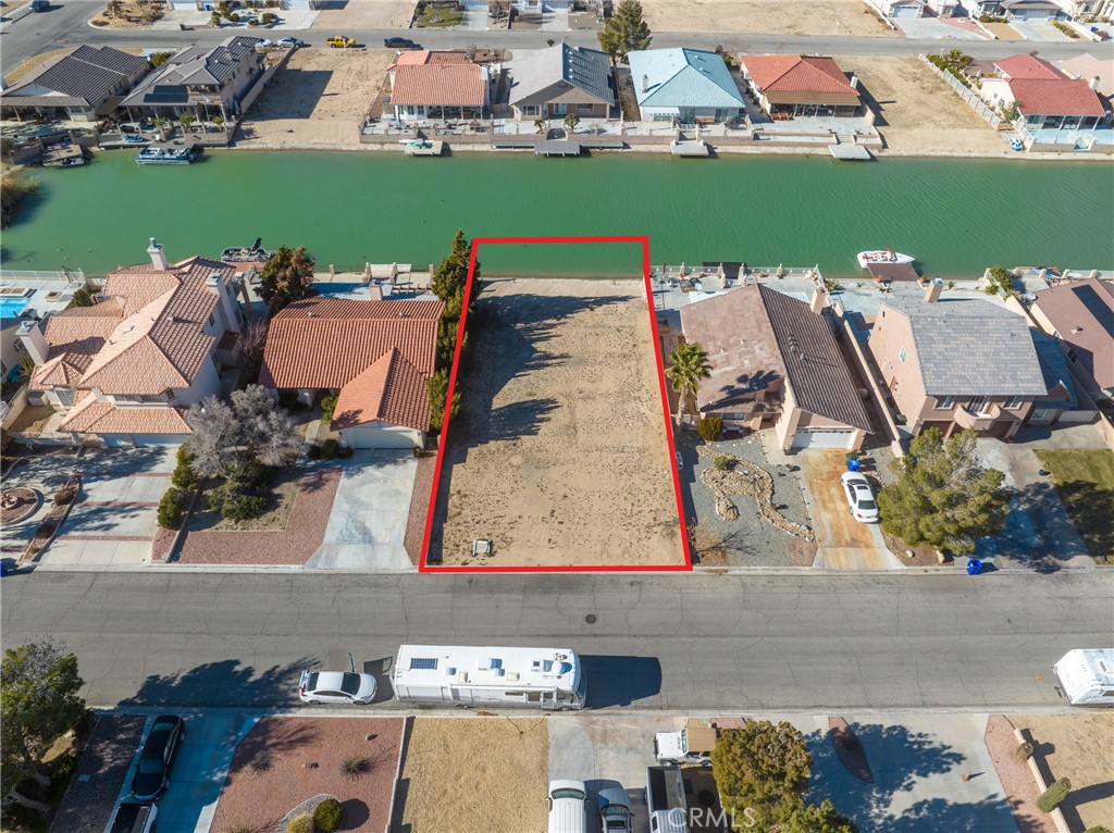 You can own your piece of the water front lake with purchase of this level lot on the canal. Silver Lakes Association states that there is no additional Soils Testing on this parcel. Remember there are only so many water front properties left and when they are gone, that's it! So if you desire to build your next home on the water, check out this amazing parcel. Standard lot size 60' x 132'. All utilities are underground and at the middle of the street. Bring your plans or architech and make this yours. Purchase gives you automatic membership to the Silver Lakes Country Club. Home Owners Association fee and Gives you free access to: Unlimited Golf, tennis, olympic size swimming pool, sauna, spa, club house, ball room, parks, equestrian area (for the horse enthusiast). And more for you to enjoy!! BONUS -- Notice there are block walls on both sides of this lot. BIG savings for you.