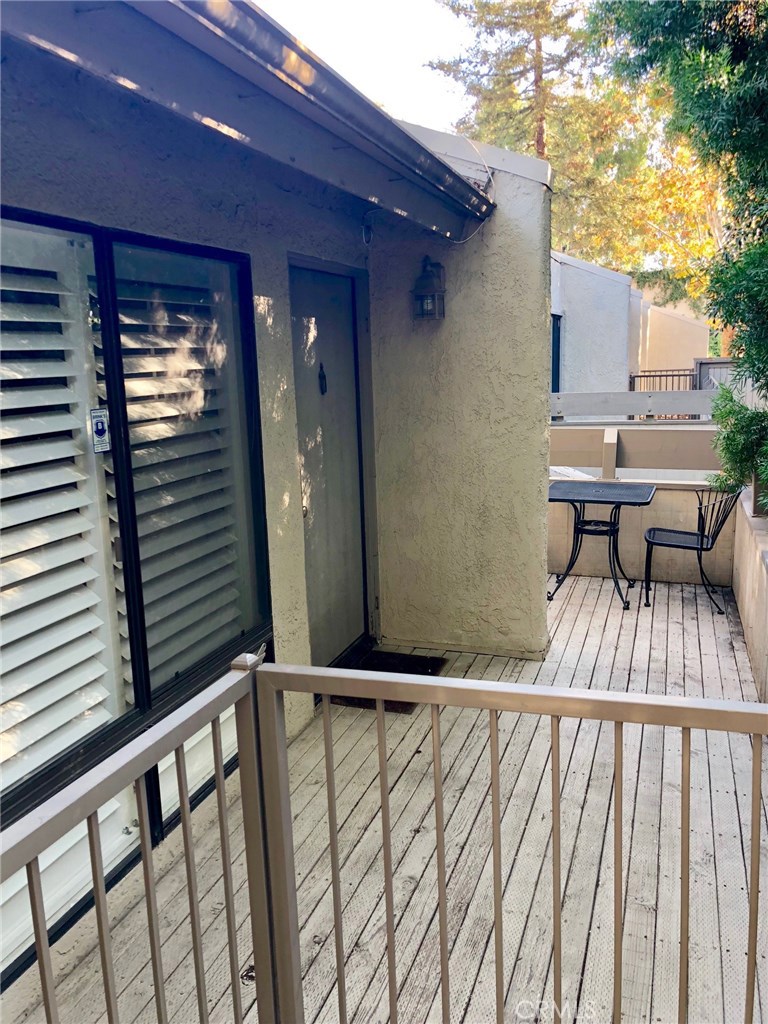 Welcome to 3032 Associated Road, Unit #90 - UPPER level unit, located in the Parkridge Condominiums, Private GATED community. This beautiful One bedroom, One large bathroom has been completely remodeled. This incredible open and spacious unit with a private patio to sit, relax and BBQ. The living room with its vaulted ceiling, breakfast bar area with stools, separate dining room area, kitchen with plenty of counter space and large pantry. The full bathroom with shower and tub, newer vanity and extra closet space for linens and storage. The master bedroom with an over sized walk in closet. Additional upgrades are new paint throughout, newer wood flooring, new carpet, remodeled bathroom with tile flooring, newer crown molding and base boards, raised panel doors, recessed lighting, plantation shutters, ceiling fans, granite kitchen counter top, newer wainscoting in the bathroom and master bedroom, Central A/C and much more. This unit is steps away from the detached ENCLOSED ONE CAR GARAGE, #90 and plenty of guest parking! Common areas include pool, heated spa, laundry room, workout gym and clubhouse. This complex is just minutes to Cal State Fullerton, Craig Regional Park, Brea Mall, restaurants and much more. A must see!!