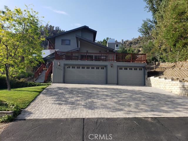 Are you looking for a custom built home.. in Wrightwood.. with AMAZING views of the Blue Ridge mountains? Then this home is perfect for you! Just imagine starting each day sitting outside on the deck with your morning coffee, listening to the birds and taking in all the beauty of the mountains and trees, or relaxing in the spa after a long day. This beautiful home features 2098 square feet with 3 bedrooms, 2 1/2 bath, bonus room (could be a fourth bedroom, office or a den), nice sized bedrooms, deck outside master bedroom, custom composite doors from the deck entering into the living room, french doors with built-in mini blinds entering into the Family room, travertine flooring in the bathrooms, granite counter tops in the kitchen and bathrooms, ceiling fans, dual-pane windows, well insulated, surround sound inside and out, wood burning stove in the living room, trex decking (no maintenance) leading to the spa, motion lights on the outside of the home, paver driveway (beautiful and melts the snow faster than concrete), PAID SOLAR, landscaped, sprinklers in the front and back on timers, rain gutters, deck is newly resealed, new pant on the banisters and railings outside, septic was replace within the last 12 years. Home sits on .17 of an acre in a cul-de-sac. This home is truly amazing.. you wont be disappointed *Cameras on the inside and outside of home do not stay* Association Amenities: None # of RV Spaces: 0 Special Features: PTRYNONE Frontage Type: National Forrest Lot Location Type: Standard Location Landscaping: Sprinklers # of Attached Spaces: 3 # of Detached Spaces: 0
