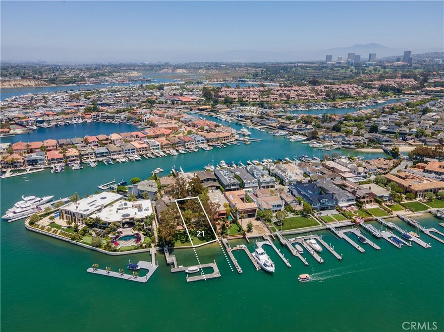 On offer is one of two lots from this iconic bayfront estate, being presented here in the form of one fifty-foot wide parcel with the address of 21 Harbor Island. Situated on Harbor Island - Newport Beach's most sought after address - and overlooking the main turning basin, this parcel features the very best views and the very best location one will ever find in Newport Beach on the water. This is a singular opportunity to acquire an unbuilt lot in an ultra-prime location upon which to create one's dream home on the bay. The building envelope is substantial and is complemented by a mature garden with stately trees and long green lawn running down to the water's edge. A relocated and reconfigured dock will accommodate up to an 85' yacht - possibly longer. No subdivision is necessary, as the lots have always been independent and were never merged. The home on the adjacent lot (20 Harbor Island) is available as part of a package offering of both lots for $59,000,000.