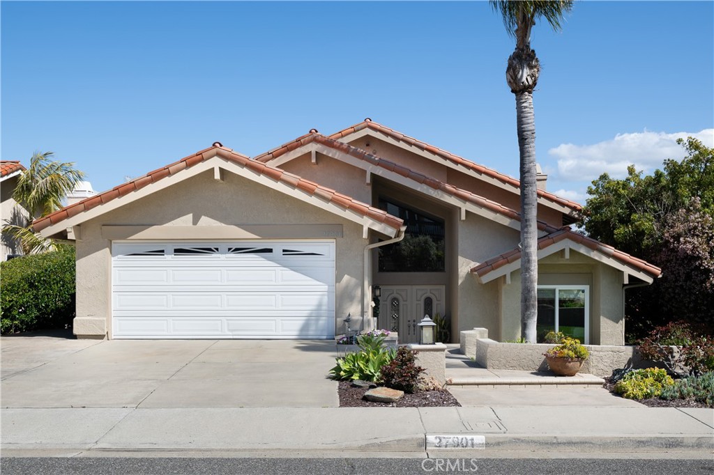 Welcome to this Stunning 4 Bdrm,3 bath home w/ views galore. Located in the serene Los Corrales community of San Juan Capistrano. Enter into a spacious entry, graced w/ a beautiful chandelier & vaulted ceiling. This open 2885 sqft floorplan embraces natural light throughout each room & perfect for entertaining or relaxing w/ brilliant views. Featuring upgraded flooring,newer paint w/ high baseboards,arched doorways,tray ceilings w/crown molding,dual pane,cased in windows & absolute pride of ownership. The dining room shines w/ a gorgeous chandelier,tray ceiling w/crown molding & overlooks the living room,reading area & open backyard retreat. The living room includes a wood-burning fireplace highlighted w/ a wood mantel & shiplap accent. Open the French doors to the backyard retreat w/ custom pavers, lush foliage, fruit trees, serene fountain & an inviting wood deck w/panoramic Mtn. views. 10,440 sqft lot provides great privacy & perfect for entertaining.Remodeled kitchen features a walk-in pantry, tray ceiling w/ recessed lighting, stainless steel newer appliances,double sink,granite counter tops, island w/ a 5-burner gas stove-top & breakfast area. The Kitchen overlooks the family room w/ a brick fireplace & French doors connecting to the peaceful backyard.The 1st bedroom is located on the entry level w/ an adjacent 3/4 bathroom,featuring a wood vanity w/ granite countertop,custom mirror,recessed lighting & tiled shower. Make your way upstairs,admiring the shiplap accent wall to the remaining 3 bedrooms & 2 additional bathrooms.The Jack & Jill style bedrooms include a connecting full bathroom which features dual sinks, separate tub & shower room w/ tiled flooring.The private main retreat is breathtaking, including a separate sitting room w/ a spacious closet.The natural light,wood-beam vaulted ceiling & tranquil view from your primary room creates a spectacular ambiance.Enjoy the roomy walk-in closet on your way to relax in the spa like bathroom including a jacuzzi tub w/ custom tile,dual sinks,granite counters,custom mirror,lighting & vaulted ceiling.A separate custom-tiled shower w/ granite seat & multiple linen closets finish the primary bathroom off perfectly.2 car garage w/ gas/electric washer dryer hook ups & plenty of side storage w/a pull-down ladder to additional storage above.Epoxy flow re-pipe,reroof in 2016 & newer A/C & furnace in 2017. Located close to parks,schools (St Margaret’s private)golf course,shopping & downtown San Juan Capistrano.