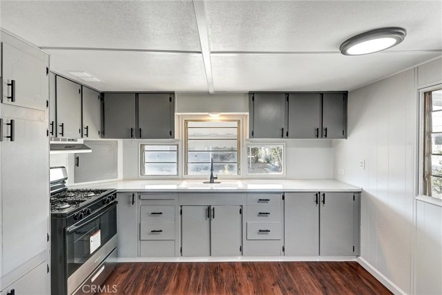 Come take a look at this freshly updated home in a family park, at a great price!  This unit has been recently painted inside and out.  Includes a brand new stove, new mini split for heat and a/c, and a new water heater. New laminate flooring throughout (no carpet!) and mostly new windows. Also features indoor laundry hookups plus freshly refinished countertops, updated hardware and light fixtures. The community has a pool, playgrounds, clubhouse and community center, laundry facilities, and is gated.  It's a wonderful location with easy access to the mountains, desert and lakes.

It is just minutes away from restaurants, universities, schools, and more. With on-site management and a night guard, you can relax with peace of mind.