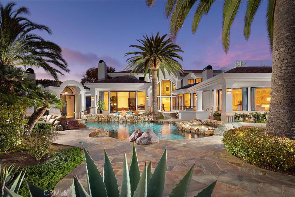 ABSOLUTE AUCTION, WITHOUT RESERVE by DeCaro Auctions International.
Palm Springs resort life meets Laguna Beach coastal luxury in this unmatched custom villa situated on a spanning half-acre oceanfront lot in the exclusive gated enclave of Smithcliffs. Meticulously designed by award-winning architect, Brion Jeannette, this estate fulfills every desire and ensures that no need goes unmet. The open floor plan of the main level includes a stately office unlike any other, a grand gourmet kitchen, elegant family room, and coveted main floor master retreat. Other rooms throughout the 10,100+ sq ft of living space include a Game Room, sophisticated formal dining room, an oceanfront guest house w/separate entry and kitchenette & 6 secondary bedrooms with en-suite baths. The resort-style exterior holds an inviting pool, spa, and waterfall that are surrounded by an expansive stone patio, offering plenty of space for basking in the sun. The tropical landscaping provides much-needed seclusion and invites you to indulge in your personal paradise.