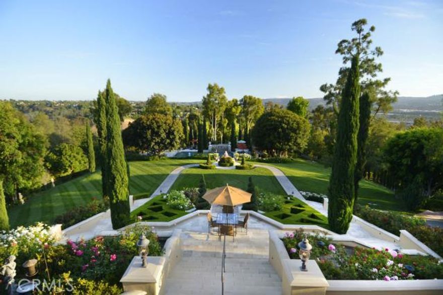 An oasis unto itself... Set atop the coveted southwestern hills of Nellie Gail Ranch, this custom built and meticulously designed home combines the very best of elegance, quality and style.  Delight in the gorgeous, expansive views of the surrounding city and coastal hills from this truly magnificent home. Over four acres intelligently developed, encompassing all you desire.  Enjoy rose gardens, a multitude of outdoor entertaining spaces, equestrian facilities, lit tennis court, mediation pool, exquisitely designed pool and cabana/guest quarters – all set amongst rolling hills.  For the privacy and security driven buyer, this resort-like property is unsurpassed. Rarely do you find the opportunity to acquire this one of a kind, turnkey, and truly pinnacle property in Orange County.