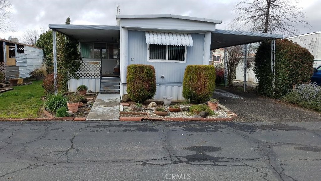 This comfortable 2 bdrm 1 bath mobile is located in one of the nicest senior parks in the county. Enjoy year round living in the screened in porch and the yard will please the gardener in you. There is some TLC needed but if you have a senior looking for an affordable place to live this one could be perfect.