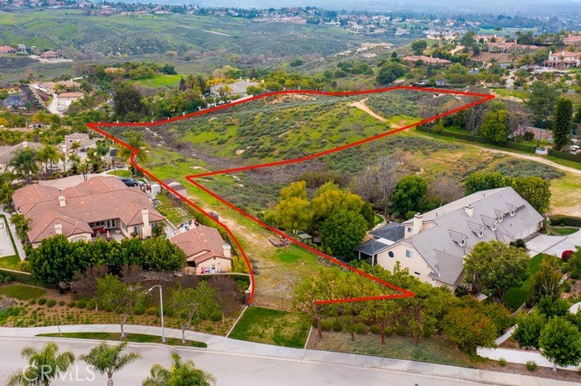 Prime Location! Situated in one of Riverside's most prestigious areas, this exceptional opportunity allows you to create your dream home. Perched on an expansive 5-acre lot, plus an additional 0.35-acre driveway, this elevated property offers breathtaking views that ignite endless inspiration. Whether you envision a grand estate or a unique architectural masterpiece, the vast land provides limitless possibilities to bring your vision to life. Surrounded by stunning luxury homes, this is the neighborhood’s most impressive lot, boasting unmatched, awe-inspiring panoramas—an extraordinary canvas for your aspirations.