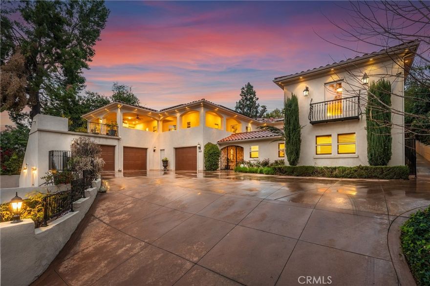 Luxurious Mediterranean Estate with Modern Amenities - Discover this stunning Mediterranean resort-style estate, a perfect blend of timeless elegance, high-end finishes, and modern convenience. Nestled near Smiley Heights and Sunset Avenue, this five-bedroom, four-bathroom home (with an additional two powder/guest bathrooms and a half bathroom by the pool) offers an unparalleled living experience with exquisite architectural details and state-of-the-art features. Key Features: • Grand Courtyard & Entryway: Step through the impressive front entrance into a charming courtyard with a beautiful fountain, setting the tone for this exceptional property. • Spacious Interior: The home boasts an open-concept design with real wooden beams and large windows (with Hunter Douglas window treatments) that allow for abundant natural light. • Gourmet Kitchen & Dry Bar: The chef’s kitchen is a masterpiece and an island, complemented by a stylish dry bar—perfect for entertaining. It has travertine marble floors. • Elevator & Smart Home Technology: Enjoy effortless access to all levels with a private elevator, while the Control4 system provides seamless automation for lighting, sound, security, and climate control. • Outdoor Oasis: The expansive patio features a built-in fireplace and grill, making it ideal for al fresco dining and entertaining. The patio has multiple dwarf citrus trees on beautiful planters. The beautifully landscaped backyard has a separate fire pit area. • Sustainable Living: Equipped with fully paid solar panels, this home is both energy-efficient and environmentally friendly. This house has 2 tankless water heaters and 3 HVAC systems. • Luxurious Bedrooms & Baths: The primary suite is a sanctuary, complete with a spa-like en-suite bathroom, huge walk-in closet, and Juliet balcony. Each additional bedroom is generously sized with its own unique charm • Three-Car Garage & Central Vacuum System: A spacious three-car garage provides ample storage, while the central vacuum system adds an extra level of convenience. • Fruit Trees & Lush Landscaping: Enjoy the beauty and bounty of mature fruit trees (persimmons, apricot, peach, fig, plum, oranges, pomegranate, guava) adding a touch of nature to this luxurious retreat. Don’t miss the opportunity to make this dream home yours! Schedule a private showing today!