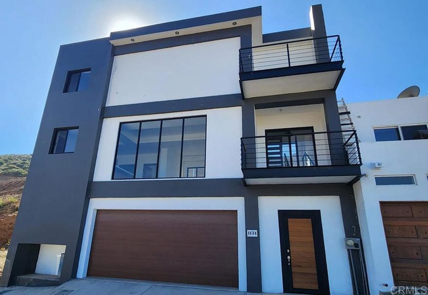 NEW PRICE! Beautiful residence ready to be opened and enjoyed. Conceptualized in three levels which are distributed as follows. First level, large garage with tile floors and capacity for two cars.  Its modern wood designed in metal and staircase takes us to the second level which is distributed in living room, dining room, kitchen with granite base, half bathroom, laundry room with access to the rear patio which has a terrace and a patio that It craves a unique design, since the natural elements of the land can be mixed with an ideal project for an entertainment area. Its third level welcomes us with a terrace with a spectacular view of the city and the sea. Additionally, it has a television and work area, two secondary bedrooms with large closets which share a full bathroom. The master bedroom has a closet and a full bathroom, as well as a beautiful view. The house is built with high quality materials. All its spaces were well cared for to provide its future owner with harmony and warmth as a whole.  Located in the northern part of the city, very close to Calle Decima, one of the most important arteries of the city and immediate access to the Ensenada-Tijuana scenic highway. Close to schools of all levels, supermarkets, restaurants, hospitals, churches, gas stations and businesses of all kinds.  Just 5 minutes from the center of Ensenada, 30 minutes from Valle de Guadalupe, 1 hour from Tijuana and 1.15 from the border with the United States.