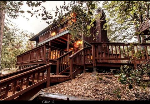 Photo of 25370 Point Of Rocks Road, Idyllwild, CA 92549 (MLS # IV25048053)