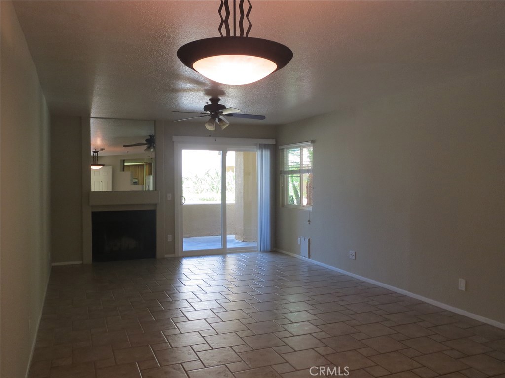 A highly upgraded, ground floor Huntington Bayshore condo that will not stay on the market for long! Included is a side by side washer & dryer, refrigerator, all built in appliances, custom tile floors, granite counter top, wood burning fire place, as well as upgraded tile shower & bathtubs! Ceiling fans throughout the property along with double windows with secured locks. Located just 3 blocks to the beach. HOA includes pool, spa, and bbq! 2 underground parking spaces located conveniently next to the elevators. The complex is secured throughout. This condo shows well - very upgraded, clean, and sharp. Pet friendly too! Available for Move In November 27th or sooner.