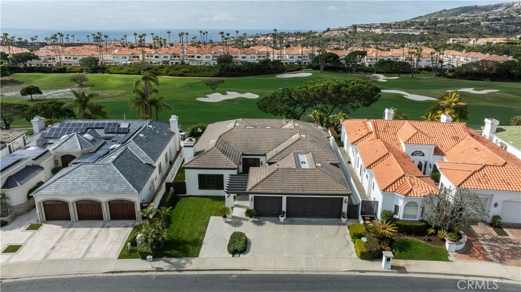 Experience luxury living on one of the most desirable streets in Monarch Beach with this exquisite single-level home offering panoramic golf course views and partial ocean views. Located in a prestigious guard-gated community, this spacious 3-bedroom, 2.5-bathroom home features over 3,000 square feet of living space, a grand entrance with soaring ceilings, and an open-concept living and dining area. The upgraded kitchen is a chef’s dream with Quartz countertops, stainless steel appliances, a large center island with service sink, and a breakfast nook overlooking the golf course. Additional highlights include new luxury vinyl flooring throughout, fresh interior paint, a flexible family room that can serve as a den or fourth bedroom, and a 3-car garage. The entertainer’s backyard offers a serene setting with breathtaking views. Ideally located near Salt Creek Beach, the Ritz Carlton, Waldorf Astoria, golf, trails, dining, and top-rated schools, this move-in-ready home embodies the best of upscale coastal living.