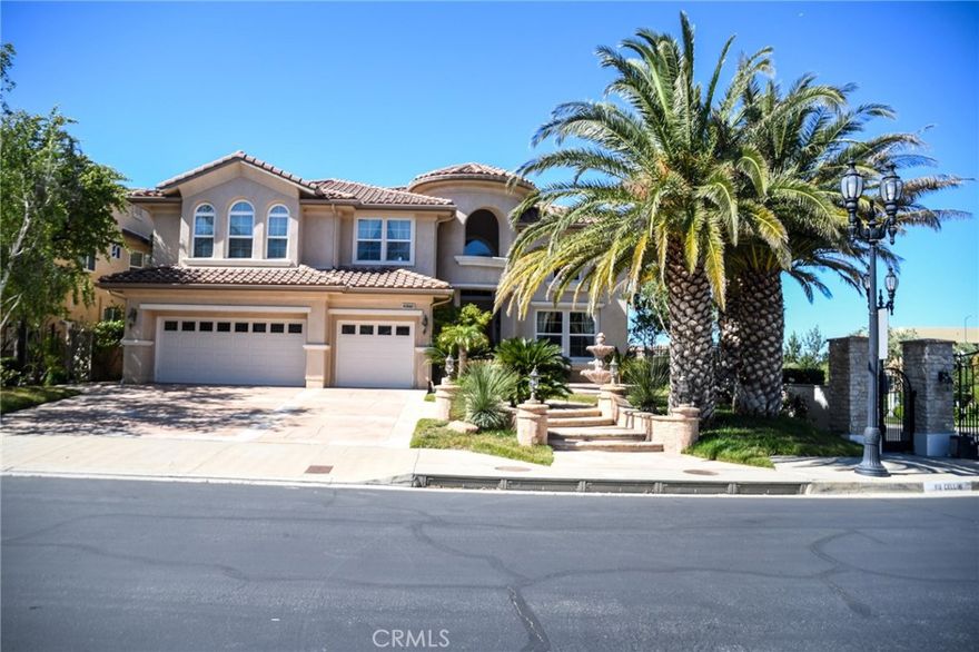 New Price Improvement!!! Bring your vision and create your personal touches and style with this Attractive 5 bedroom 5 baths corner lot Residence with a pool in the Private "Renaissance" exclusively guarded 24/7 gated community with award winning Porter Ranch Community School (K-8) within close proximity. The property features a grand entry way with marble flooring, high vaulted ceilings in the foyer throughout the formal living room and dining room which leads to the open kitchen. Great landscape in the front and backyard with views of the mountains and the valley. This home is perfect for entertaining!
