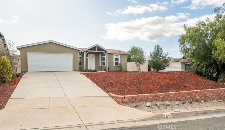 Opportunity knocks with this Newer and Turnkey 4 Bedroom 2 Bathroom 2 Car garage manufactured home in The Farm community of Wildomar. This rare find has a lovely elevated view and features a Modern floorplan with High Ceilings and lots of natural light, Kitchen Island, Stainless Steel Appliances/Frig, Soft-Close Cabinet/Drawers, Walk-in pantry, Dual pane windows, French doors with integrated adjustable blinds, Separate Laundry/Mud Room with exterior door, Ceiling Fans throughout, Coffered ceiling in family room, Vinyl Plank flooring and carpet in all the right places, Master with Separate Tub, Shower, Dual sinks and Walk-in closet, Alumma-Wood Back patio, Vinyl Fencing, all situated on a 7,841 Sq Ft Lot. The community has pools, parks, tennis courts, basketball, RV parking, clubhouse, fishing pond and neighborhood friendly orchards plus Low HOA and Low Taxes makes this one a must see!