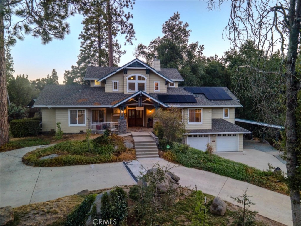Luxurious Mountain Home with Pond Frontage – Perfect Dream Home or Profitable Airbnb!
This spectacular mountain home, set alongside a serene pond, offers the ultimate family retreat or a highly successful Airbnb opportunity. The stately front porch and impressive curb appeal set the tone for the home. Entering, you're welcomed by expansive windows showcasing stunning pond views, effortlessly blending indoor and outdoor living. With 4 bedrooms, 3.5 bathrooms, this 2,877 sq ft home balances elegance and comfort. The formal living room and den are divided by a two-way fireplace, adding warmth and charm. The gourmet kitchen is every chef’s dream, featuring six-burner Thermador range, double ovens, a large island with a prep sink, and pantry. The open layout includes a breakfast bar, dining area, and formal dining room with sliding barn door. On main level, is a spacious bedroom, separate full bath, and expansive primary suite opening onto a patio; the suite’s luxurious bathroom has sunken shower and oversized walk-in closet. Convenient laundry room with abundant storage and deep utility sink is also on this floor. Upstairs, 2 bedrooms share a well-appointed bathroom, offering ample space for family or guests. Large garage has been converted into a massive game room, perfect for entertainment and relaxation. Solar loan assumable. Outside, RV parking with 30-amp service provides convenience and guest flexibility. This home offers a rare opportunity to enjoy mountain living with all modern amenities and comforts you need for an extraordinary lifestyle—or a premier short-term rental!