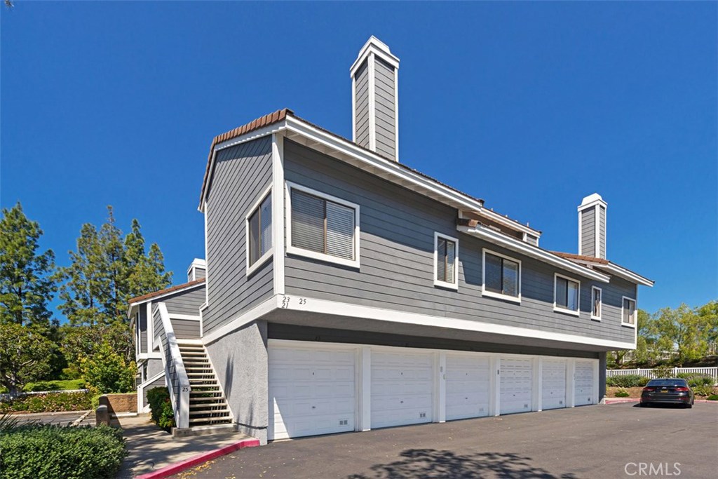 Rarely on the market, this charming 2 story, 2 bedroom, 2 bathroom, corner upper level carriage unit boasts a spacious open concept floor plan featuring vaulted ceilings, open kitchen and generous great room. Take the spiral staircase up to the private master bedroom with tons of closet space and remodeled full bathroom complete with new tile flooring and new vanity. Dual French doors open up to the large 2nd bedroom as well as a private bathroom with new tile flooring, new vanity and shower. This home also includes a one car garage with plenty of extra storage space as well as a large private patio. Enjoy the amenities that Heather Ridge offers which include 2 spas, 2 tennis courts, BBQ area, a swimming pool, and abundant unrestricted parking plus low association fees and no mello roos.