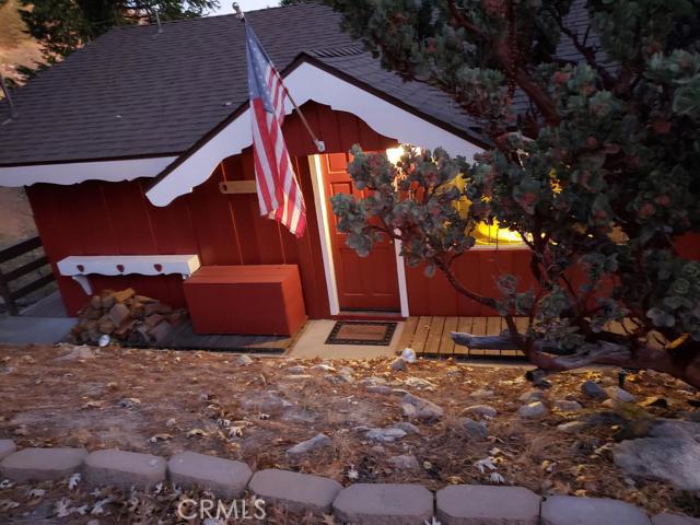 Great Commuter location on Live Oak with Beautiful view of the city lights. One level including 1 bedroom 1 bathroom laundry room and a deck where you can enjoy the views and have the quiet and peaceful mountain experience. This could be your perfect family holiday retreat. Features a driveway with parking for 2 and another parking spot in front of the house. The lot to the right of the house is included it is 1/2 an acre. It is zoned for Horse property per Seller. If you are lucky you may see deer strolling through your yard in this majestic setting.