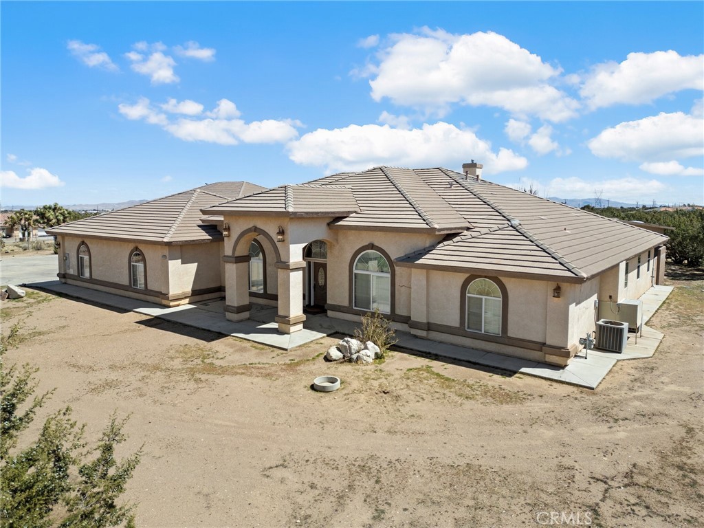 Welcome to your dream oasis! This beautiful custom home, boasting over 3,500 square feet of luxurious living space, is nestled on more than 2 acres of secure, fully gated land. With five spacious bedrooms and three well-appointed bathrooms, this residence is perfect for families and entertaining alike. Be captivated by the breathtaking views of the San Gabriel Mountains to the west. The expansive backyard is a true retreat, featuring professional landscaping, a huge Jacuzzi, and an enclosed guest house complete with a full bath—ideal for visitors or as a private workspace.
The heart of the home is the large open great room and kitchen, designed for seamless entertaining and family gatherings. The primary suite is a personal sanctuary, featuring an attached bath with a luxurious stone shower and a cozy fireplace, perfect for relaxing after a long day.
For those with a passion for vehicles or hobbies, the property includes an oversized workshop, approximately 2,800 square feet with 16-foot ceilings, capable of housing at least eight large vehicles. An additional three-car garage provides even more space for your toys and tools. The workshop features RV pull-through access, making it convenient for all your needs.
This home is equipped with modern conveniences, including a water softener and a central vacuum system, ensuring comfort and ease in daily living. Located just a mile from all paved roads, this property offers both tranquility and accessibility.