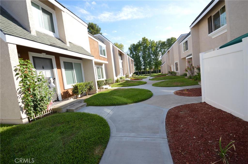 Beautiful 2 bedroom plus 1 1/2 bath condo available in Heritage Park. This condo features laminate flooring on the first floor, upgraded kitchen and own laundry area with full size washer and dryer. Two spacious bedrooms are located on the second floor, both with air conditioning units and ceiling fans. One bedroom has large walk in closet , while the other features an entire wall mirrored closet. Unit also has quaint patio for relaxing. Community features pool and park. Close to 5 freeway and several restaurants, grocery stores.