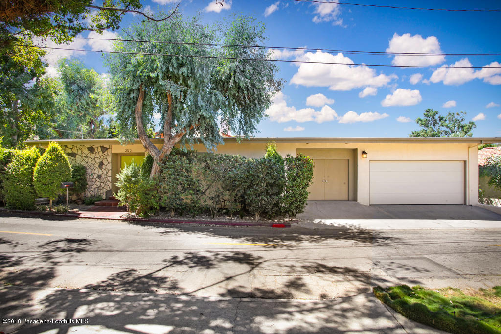 Offered for sale for the first time in more than 45 years, this stylish mid-century has been lovingly maintained and updated. Situated on a downslope lot, the property has an airy treehouse perspective. The living areas and master suite feature walls of glass and are conveniently located on the main living level. Multiple skylights add even more light to an already bright space. Three spacious bedrooms are located downstairs. One of the bedrooms has a private entrance and would be perfect for a nanny or au pair. The living room, dining room, and master bedroom open onto a sunny terrace. The kitchen opens onto a walled patio that functions as a true outdoor room. The fully-fenced yard offers a flat grassy space where kids and pets can play safely. The master bathroom opens to a bonus space, currently in use as an exercise room. Southern California living at its best!!