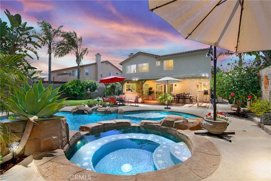 Welcome to your dream POOL home in one of Riverside’s most coveted neighborhoods! With No Rear Neighbors, this beautifully maintained 4-bedroom, 3-bathroom Orangecrest POOL home features an inviting open floor plan flooded with natural light, creating a warm and welcoming atmosphere. The elegant dining room boasts vaulted ceilings and large windows that allow sunlight to pour in, highlighting the spacious layout. A classic chandelier adds charm, making it perfect for hosting family dinners and entertaining guests. The heart of this home is the modern kitchen, equipped with stainless steel appliances, ample cabinetry for storage, and a central island offering additional counter space and a spot for casual gatherings. The expansive countertops and efficient layout make meal preparation a joy, while the bright, airy design invites culinary adventures. The cozy family room features large sliding glass doors for seamless access to the outdoor patio and garden. Enjoy your 1st summer in many comfortable seating areas, plenty of breezeways for warm days, and a fireplace for cooler evenings. Step outside to your private backyard oasis, ideal for both relaxation and entertainment, with a covered patio perfect for alfresco dining or unwinding in the beautifully landscaped garden which features a sparkling pool and a luxurious hot tub, surrounded by lush greenery and vibrant flowers. With nearly a 10,000 sqft Lot; the gently sloped back wall affords this large backyard plenty of privacy. Additional features include light-filled interiors, spacious bedrooms with ample closet space, and convenient proximity to schools, shopping, and recreational facilities. Side yard dog run with spray misters; newer pool pump equipment; 3-car garage. *NO HOA* Combining classic elegance with modern comforts, this home offers a serene and stylish living experience. Don’t miss the opportunity to make this stunning house your new home! Broker and agents do not represent or guarantee the accuracy of the square footage, income, expenses, condition, development potential, bedroom/bathroom count, lot size or lot lines, dimensions, permitted or non-permitted spaces, or school eligibility. Buyer is advised to independently verify the accuracy of all information with appropriate professionals. There are no warranties or guarantees, buyer to rely solely on his/her own findings.