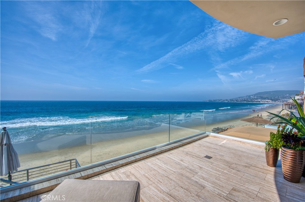 Centrally located on the sand in the heart of Laguna Beach, this jewel of real estate sits on one of Orange County’s most picturesque beaches. This beachfront property boasts spectacular sunset views of Catalina and San Clemente Island. Masterfully redesigned, this home exudes the finest finishes one expects to find in a property of this caliber. Entering into this property one is immediately mesmerized by the sapphire effulgence of the Pacific. The modern transitional design with accordion doors brings the ocean into the everyday interior living experience. The unparalleled sensation of this property is waking up every morning to the sounds and majesty of the California coast. This is one of the few properties on the coast that embodies an internal courtyard fully equipped with built-in barbecue, fire pit, and lounging area to enjoy with guests. Off of the courtyard is a detached guest quarters for family and friends to vacation with you. Just foot steps to the finest restaurants, beaches and cafes, one will experiences the euphoria of living in Laguna Beach. Come indulge yourself in the serenity, majesty and fulfillment of this divine property.