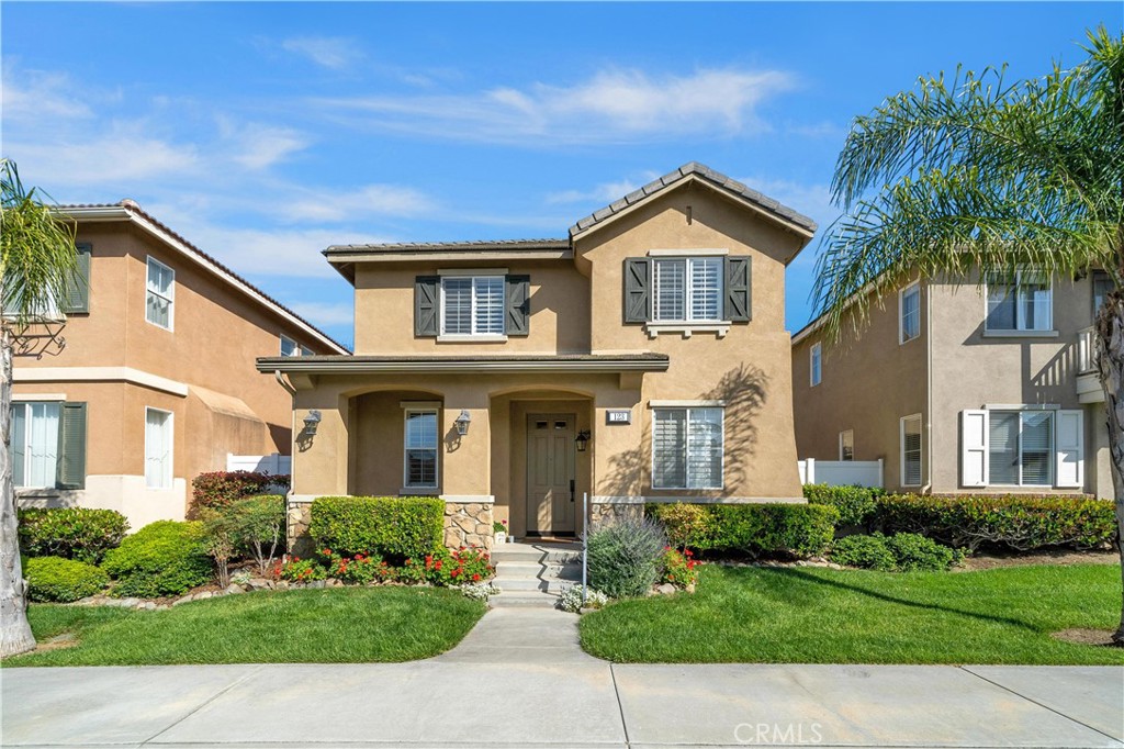 Welcome to 123 Hyde Park! Enjoy a quiet interior location, within the gated community of Parklane, this home is waiting for you! From the moment you drive down the street, you will see the charming curb appeal of this home. Enter from the quaint front porch, where the entry and hallway provide a sight line into the quaint, private backyard. The home office/den, accented with French doors is off the front entry and could be the perfect space for a gym or homework area. Down the hall is the highly sought-after open floor plan with the kitchen open to the dining area and living space, with a fireplace as its centerpiece. The great room layout is ideal for everyday living as well as entertaining family and friends. The kitchen with stainless steel appliances and granite counters, offers a large island with storage and seating for casual dining. The main dining area has large French doors leading the backyard patio, letting you extend the indoor living outdoors. Access your two-car garage, just across the patio. Relax and recharge in your tastefully designed backyard area accented with stone and grass inlays. You’ll find a perfect spot for dining on warm summer nights, a casual space for conversation as well as a grassy area, perfect for kids or pets. Plantation shutters and stone floors on the main level add a sense of continuity to your living space. The downstairs is complete with a guest bath and separate laundry room. Going upstairs, the oversized custom windows offer privacy while letting sunshine flood the stairway and upstairs. To the right you’ll find the spacious primary suite, which overlooks your backyard. The spa-style bath features a dual vanity as well as separate tub and shower and toilet room. A generous walk-in closet completes the bath area. The primary suite is separated from the two secondary bedrooms, offering the utmost in privacy. To the left each bedroom features plantation shutters and mirrored wardrobes. The hall bath completes the second level. Within the highly rated Irvine School district and steps to the resort like pool, spa and kiddie pool, Harvard Park just next door is an added bonus! Just a short drive to shopping, dining and freeways. This one owner home has been meticulously maintained over the years. No Mello Roos and a low HOA of only $215/mo. make this a wonderful opportunity at this price. Welcome Home!
