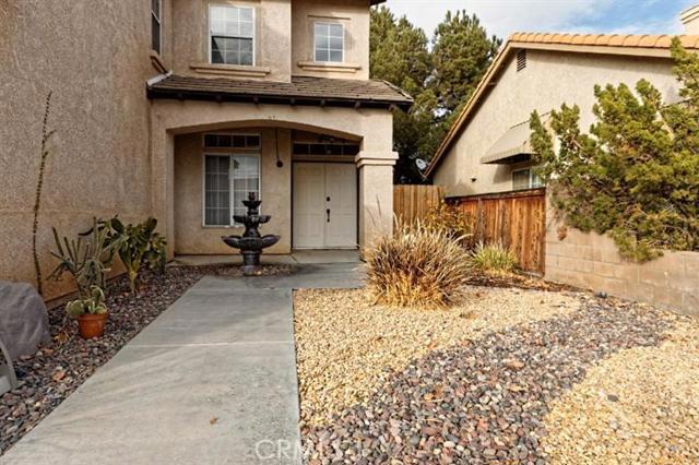 Gorgeous hacienda style home in Eagle Ranch. Upgraded with Spanish tile, granite counter tops, stainless steel appliances, bronze lighting and fixtures, and more! All bathrooms have new vanities, and faucet hardware. Master bedroom has been remodeled with wood plank look tile flooring for the rich look of wood, but easy care and durability of tile. The master bathroom is a must see! Custom dual sink vanity and new tile shower with oversized shower head. Master closet has a custom closet renovation for the pristine look of a well-organized closet space. The upstairs space is furnished with a spacious loft. The window arrangement in the home affords lots of natural light, and a the floor plan is welcoming with an open and accessible floor plan. On top of all the gorgeous finishes inside the home, you'll find double door entry with a welcoming courtyard, designer rockscape, and of course that green belt of grass that makes every house feel like a home. Covered patio with grass in rear. Association Amenities: None # of RV Spaces: 0 Special Features: BN,CC,,LF,NONE Lot Location Type: Standard Location Landscaping: Full Special Features: Garage Door Opener, Underground Util: # of Attached Spaces: 2 # of Detached Spaces: 0