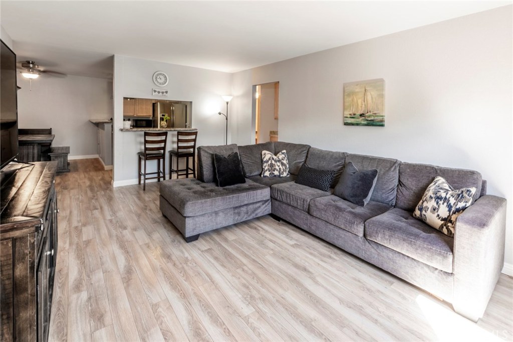 Recently remodeled 2 bedroom 2 bath, lower unit condo, with private patio in the beautiful Monterey Villas community. Enjoy the upgraded laminate floors, Graber cellular blinds, island vent, new bathroom heating and fan, and new ceiling fan in master bedroom. Also includes granite counter tops, stainless steel refrigerator, dishwasher, and new paint throughout. Tustin Unified School district, and walking distance to grocery stores, shops, dining, and gym. Close to 55 and 5 freeways. Amenities include pool, BBQ area, spa, clubhouse, tennis courts, and gym. Clean, and well maintained through HOA, which includes water and trash. There are two laundry areas, one carport, and mailbox area in the middle of the community, and in the process of being fully gated. DirecTV and cable ready.