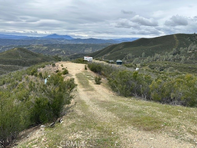 20+/- Acres in the Double Eagle subdivision Asl about travel trailer on property. travel trailer. Water holding tanks on property.