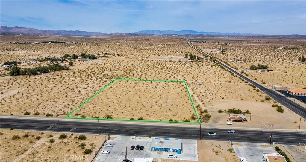 An exceptional commercial property on Adobe Road in 29 Palms. A few hundred feet from the Himalaya Plaza, the DMV , and the busy corner of Indian Trail and Adobe. This easy to develop flat 4.7 acre parcel could accommodate numerous commercial opportunities in this growing community. The High Desert is exploding with growth and tourism and affords the wise investor an opportunity to seize the moment and add to their portfolios. Owner is willing to carry with a reasonable down payment.