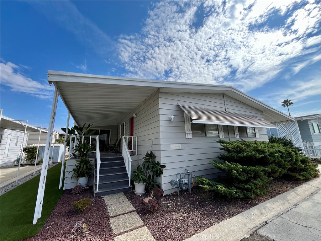 Located in the heart of the South Bay, this bright and inviting 2-bedroom, 2-bath home offers the perfect blend of comfort, convenience, and community. Thoughtfully remodeled with a spacious, open floor plan that brings in plenty of natural light, this turnkey home features brand-new floors, updated fixtures, and fresh paint throughout, plus the convenience of an in-unit washer and dryer. A front patio offers a perfect space for entertaining, while the outdoor area features low-maintenance artificial turf. The long carport accommodates up to 3 cars, and two high-quality sheds provide abundant storage or workspace. With leased solar panels, energy savings are built in, too!
Nestled in a safe, rent-controlled, pet-friendly 55+ community, this home offers one of the lowest space rents in the entire South Bay. You'll enjoy peace of mind with a safe park environment and a tight-knit community of great neighbors who watch out for each other. Community amenities include a clubhouse, pool, sauna, exercise room, billiards room, and more, so there’s always something to do or a friendly face to chat with. Located near the front entrance for easy access without the noise, you'll also enjoy being close to the 405, 91, and 110 freeways, plus shopping, dining, Victoria Golf Course, IKEA, Target, AMC Theatre, Cal State Dominguez Hills, Dignity Health Sports Park, and more.
This is truly a fantastic opportunity to enjoy South Bay living at its best in a home that’s ready for you to make it your own.