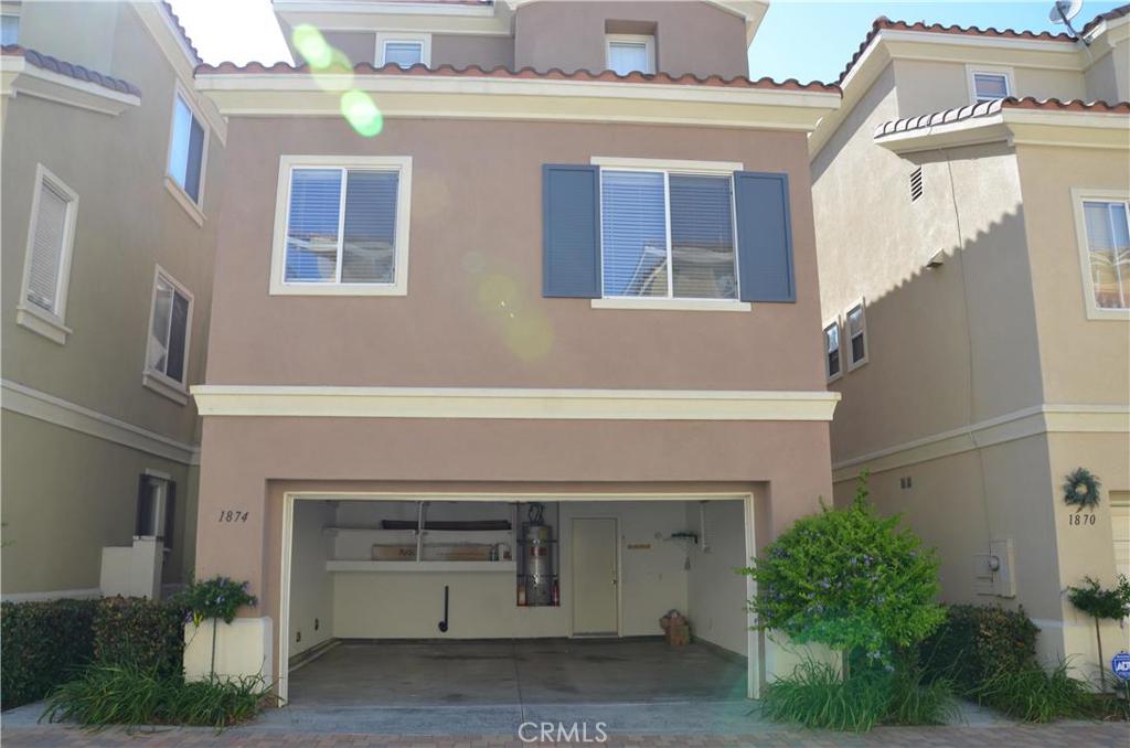 Single Family Style condo with no shared walls in the secured gated community. Three story house with 2 bed & 2.5 bath plus den/office space. Upon entering front door, 2 car attached garage and one bedroom with full bath are conveniently located on the first floor. Open floor plan with spacious Kitchen, separate dining space and large living room with a cozy fireplace are on the 2nd floor. Updated kitchen comes with corian counter tops, center island and stainless steel appliances including new 6 gas-burner cook tops. Master suite is located on the 3rd floor as well as a good sized den/office space. Master suite includes a huge walk-in closet, tiled bathroom with a large bathtub, French shutters, recessed lighting throughout. Additional bonus features includes private backyard with an outside dining set with umbrella. Front-load washer and dryer are included!