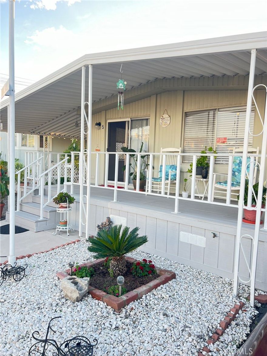 Charming 2-bedroom, 2-bath mobile home located in the Rancho La Paz Mobile Home Park. This well-maintained property features new flooring, central air, and plumbing. The spacious interior includes a master bedroom with an extension, perfect for use as a large master suite, a sitting area, or an office. The home also boasts a built-in dining area with cabinets and an inside laundry area.

Outside, you'll find 2-3 car carports with 2 sheds, along with a large lot that offers the potential to add a third parking area. Enjoy relaxing on the large, charming front porch with a view of the street. 

Residents of Rancho La Paz have access to various amenities, including a barbecue area, clubhouse, pool, spa, pool table, game room, and an additional barbecue area on the premises. The location is conveniently close to shopping centers and freeways, making it a convenient and comfortable place to call home.