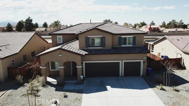 This lovely, move-in ready home in south Adelanto features OWNED solar panels, over 3000 sq ft, 5 bedrooms plus a loft, and 3 bathrooms including one bedroom and bathroom downstairs! Many upgrades throughout the house including upgraded tile flooring, upgraded carpet, and zero VOC paint! Situated very close to shopping and dining options with easy access to US 395, I-15, and CA-18, you will love the beautiful Mountain View! You can't go wrong with this home but wait there's more, you have NO REAR neighbors for added privacy! Association Amenities: None # of RV Spaces: 0 Special Features: FS,WSECNONE Lot Location Type: Standard Location # of Attached Spaces: 3 # of Detached Spaces: 0