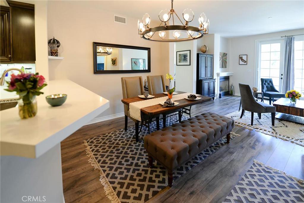 This is Playa Vista at its BEST. Stunning 3 bedroom home in the sought after Villa d'Este complex offering almost 1600 square feet on a single level. Nestled in an exclusive corner of Villa d'Este, this home offers treetop views, beautiful natural light and complete privacy. This gorgeous home has been almost completely redone and shows like a model. Beautiful and open floor plan greets you as you walk in. Dual fireplace gives warmth to both the living room and den. The stunning chef's kitchen boasts brand new quartz countertops, custom backsplash and new updated cabinetry. The master bedroom with Juliet balcony leads to a master bathroom with shower, separate soaking tub and custom built master closet. Down the hall you will find the remaining 2 bedrooms, separate full bathroom and laundry area. Side by side parking spots. Only blocks to the new Playa Vista Elementary School. Just across the street from the Playa Vista CenterPointe Club's Gym, Pool, Spa & screening Room. Nearby, the Runway at Playa Vista is home to the new Whole Foods, Cinemark Movie Theater, restaurants and more to come! You will also have access to the brand new Resort gym and pool.