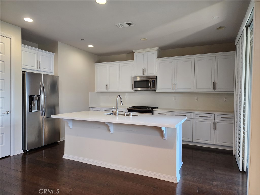 Beautiful Newer Built Town Home in Groves Community will be available immediately for move in. The three story flat plan yet open spacious layout only on the 3rd level at the premium lot. The first level has keyless entry on the front door and entrance from the garage with side by side 2 car garage. Second level will be stairs only. On the Third level it opens upto spacious floor plan with 3 bedrooms and 2 bathrooms. Upgraded Modern Kitchen, large Kitchen Island, upgraded sparkle Quartz with full backsplash, single undermount sink, contemporary faucet, Stainless Appliances, upgraded 8' doors, recessed lighting, upgraded wood flooring, Plantation shutter though out, Quartz Bathroom countertops, porcelain tile in bathrooms, Modern master bath shower, tank less water heater and much much more. Refrigerator, washer and dryer is included. ENERGY STAR® CERTIFIED HOMES are designed to help save money and energy. High-efficiency Heating and Cooling Systems, Energy-efficient lighting and appliances, Air sealing, quality insulation and high-performance windows to enhance comfort, improve durability, reduce maintenance costs and help lower monthly utility bills. Conveniently located near FWY 5 and Fwy 91, Metrolink or Amtrak to LA or San Diego, shopping, dining, and entertainment such as Disney Land.