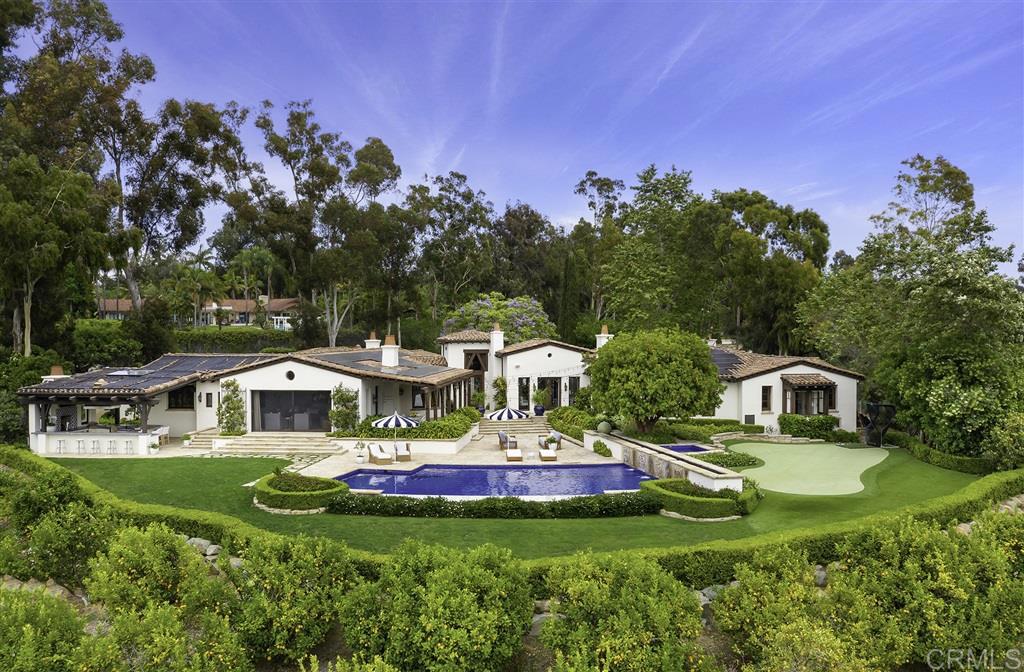 The quality, privacy, location, and stunning views of this chic single level Covenant estate cannot be overstated. Gracing a prime west side location, this magnificent 4.55 acre view site is gated and lushly landscaped. From the moment you step onto the grounds, you will be impressed with the ultimate lifestyle it has to offer: two guest casitas; large, yet intimate & inviting rooms that flow effortlessly outdoors to the picturesque pool; fully covered BBQ/outdoor kitchen with fireplace; 6-hole putting green; and a hillside of citrus trees. The main house encompasses 5 exceptionally appointed bedrooms and an executive library/wine room with custom hand carved walnut cabinetry. The romantic master suite has his and her custom designed dressing rooms, a sumptuous spa bath, coffee/juice bar, and an exercise room. The gourmet chef's kitchen, breakfast area, and over-sized family room include a spectacular vaulted, open beam truss ceiling and vanishing doors. Highlights include: refrigerated system wine cellar, private, lighted courtyard with fountain to set the mood and entertain under the stars, distressed walnut flooring, Albertini doors and windows, custom lighting, and fully owned solar.