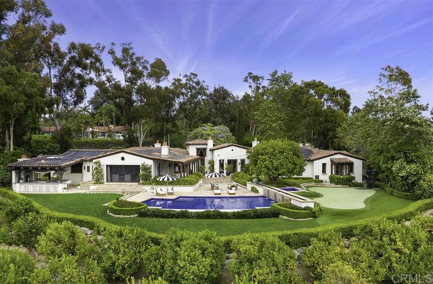 The quality, privacy, location, and stunning views of this chic single level Covenant estate cannot be overstated. Gracing a prime west side location, this magnificent 4.55 acre view site is gated and lushly landscaped. From the moment you step onto the grounds, you will be impressed with the ultimate lifestyle it has to offer: two guest casitas; large, yet intimate & inviting rooms that flow effortlessly outdoors to the picturesque pool; fully covered BBQ/outdoor kitchen with fireplace; 6-hole putting green; and a hillside of citrus trees. The main house encompasses 5 exceptionally appointed bedrooms and an executive library/wine room with custom hand carved walnut cabinetry. The romantic master suite has his and her custom designed dressing rooms, a sumptuous spa bath, coffee/juice bar, and an exercise room. The gourmet chef's kitchen, breakfast area, and over-sized family room include a spectacular vaulted, open beam truss ceiling and vanishing doors. Highlights include: refrigerated system wine cellar, private, lighted courtyard with fountain to set the mood and entertain under the stars, distressed walnut flooring, Albertini doors and windows, custom lighting, and fully owned solar.