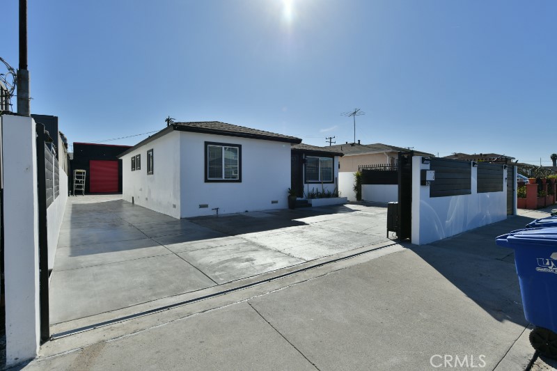 4820 West 142nd Street presents a rare opportunity to acquire two (2) freestanding buildings totaling approximately 2,334 square feet, situated on a 5,792-square-foot (.13-acre) parcel. Ideally positioned just half a mile from the 405 Freeway via the Rosecrans Avenue on-ramp, the property offers excellent accessibility and is only minutes from LAX, the Beach Cities, and West Los Angeles. Zoned CR (Commercial Regional) within the City of Hawthorne, this location benefits from proximity to a wide array of amenities along Rosecrans Avenue in both El Segundo and Hawthorne.
The front building (approximately 1,134 SF) features a wood-frame construction and was renovated in 2022. It includes three (3) private offices, an open bullpen-style entrance/lobby, and two restrooms with showers, making it well-suited for office or mixed-use applications (buyer to verify use with the city).
The rear building offers a versatile open floor plan with two ground-level loading doors (measuring 9’ wide by 11’ high). It has been completely renovated with high-end finishes and includes a large industrial ceiling fan, enhancing air circulation for an improved work environment.
The property is fully fenced and secured, featuring a remote-controlled gate for seamless access. The majority of the yard/lot is concrete paved, providing ample space for parking, storage, or outdoor work areas.