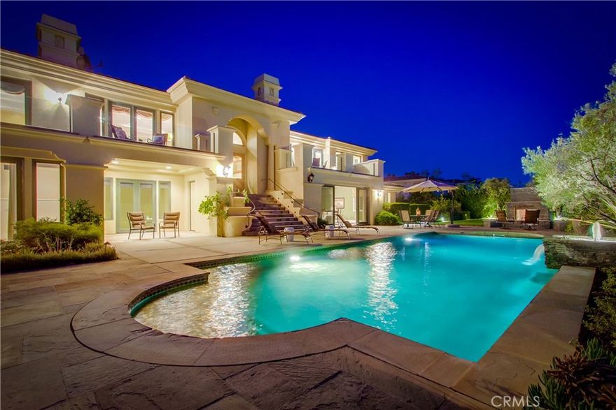 Welcome to 59 Paseo Del La Luz | Located in the prestigious Oceanfront Estates, a premiere ocean front community in Rancho Palos Verdes. This sprawling Mediterranean-style luxury California home offers one of the most desirable floor plans in this community. This expansive split-level living offers a flawless design combining a balance of formal yet elegant architecture. The upper level design perfectly pairs the dining & living room, library & music room, gourmet kitchen & family room, along with a luxurious master retreat, & two alluring & generously-sized balconies that overlook the lavish grounds, tranquil pool & spa, outdoor fireplace & lounge area, & the most captivating panoramic ocean views & sunsets that span from Catalina Islands to Malibu. The dual staircase leads to a magnificent lower level featuring an impressive Mahogany bar, conservatory & recreation room, pool table & game room, that perfectly flow to an exceptional outdoor setting ideal for entertaining friends & family. The lower level floor plan also includes a guest suite on one end, & separate teen wing w/three bedrooms, 3 bathrooms, & private family room & conservatory on the other end. Additional amenities: vaulted ceilings, custom craftsmanship, double crown molding, refinished wood flooring, new carpet, elevator, wall paneling & wainscoting, 4 car garage & so much more. Trump National Golf Course & Terranea Resort are located nearby. Come experience, embrace & indulge in paradise!