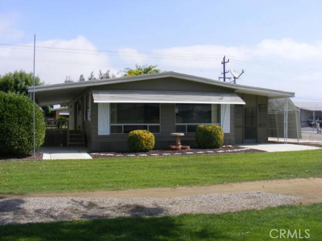This home has a wonderful view of the golf course from the living and adjoining dining room. Cathedral ceilings gives you a very open feel. Large kitchen includes an island, new counters, appliances and a small desk area. Laundry room off of the kitchen . Good sized master bedroom with full length closet with mirrored sliding doors. Master bath has double vanity, garden tub, shower and another large closet for storage and linens. Large built on shed at the end of the carport will provide additional storage.