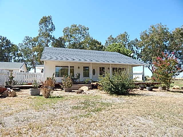 PICTURE THIS- a 2-bedroom 2 bath home featuring 1718 square feet of living space, a guest house, shop, sheds, and a manufactured home for family or additional income. Sit on the dock of the of the huge pond and feed the koi. Enjoy the peace and serenity of this 20-acre property close to Corning as well as Chico. There's plenty of room for gardening. Perfect spot to raise your animals or bring your dreams to reality. It has solar too! Call your agent and set Your appointment to see this one!