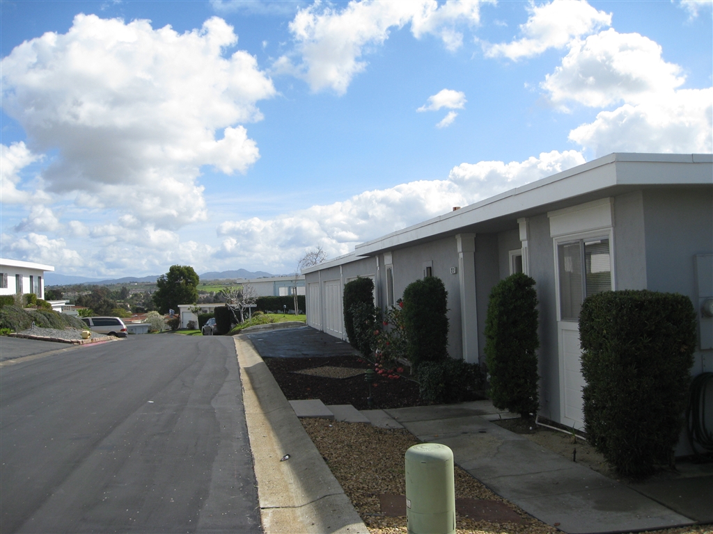 Spacious floor plan in much sought after Oceana retirement community. Sunny detached unit offers mountain views. Covered central atrium, although not part of the square footage, adds that much more space for your use. Large den could convert to 3rd bdroom. New AC & furnace & hot water heater! Close to beaches, harbor, shopping, freeways. AS IS Clubhouse offers 2 pools (1 heated) & spa, ceramics, pickleball, library, woodshop, billiards, and much more. Community garden & RV pkg. as available.. Neighborhoods: Oceana Equipment: Dryer,Garage Door Opener, Washer Other Fees: 99 Sewer: Sewer Connected Topography: LL