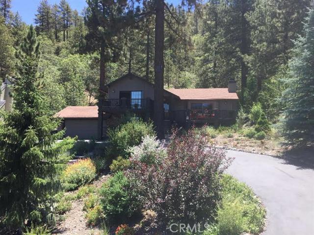 4 Bedrooms, 2.5 Baths + Extra Room Beautiful Home Situated in a Quiet Neighborhood in a Prime Location in the Village of Wrightwood, CA. Exceptional Views of the Mountains and Forest! Spacious Floor Plan with the Warmth of Two Brick Fireplaces . Mountain High Ski Resort 5 miles away (11 min.) Built in 1987 2408 sq. ft. of living space, assessor Lot size: 135'x224', assessor Landscaping & irrigation Move-in condition, furniture available Two-car, finished garage Garden shed Three well-maintained decks Inside laundry room Smoke free and pet free Window blinds throughout Association Amenities: None # of RV Spaces: 0 Special Features: BC,,TS,SHNONE Lot Location Type: Standard Location Landscaping: Sprinklers Special Features: Garage Door Opener # of Attached Spaces: 2 # of Detached Spaces: 0