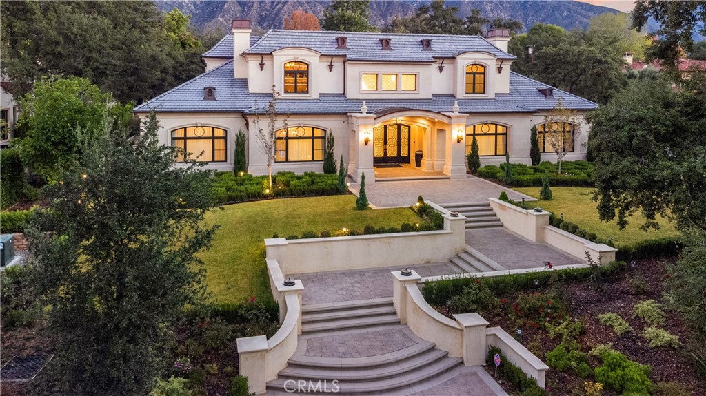 An exquisitely newly built masterpiece in a coveted street in Upper Rancho, Arcadia. This brand NEW south-facing custom construction estate inlaid with marble and wood floors invite you to discover elegant spaces made to entertain. Beautifully designed contemporary French Estate architecturally designed by Robert Tong. Step into a dramatic foyer with adorned high ceilings, glistening chandelier, imperial two-sided staircases through an iron front door. Relax in front of the fireplace in the full floor living and dining space, perfect for lavish dinner parties and entertaining. The living space is approx. 12,000 sq. ft. with a huge backyard. The terrace makes gatherings irresistible with ambient lighting and gorgeous landscaping with a built-in barbeque and infinity pool. The home includes 6 bedrooms, 8 bathrooms, a private-back house with a bedroom, bathroom, and kitchen. Additional amenities include a movie theater, Lutron home automation system, four-car garage, gym, indoor sauna and elevator. This is a truly impressive brand-new mansion in North Arcadia. Don't miss out on this spectacular property!